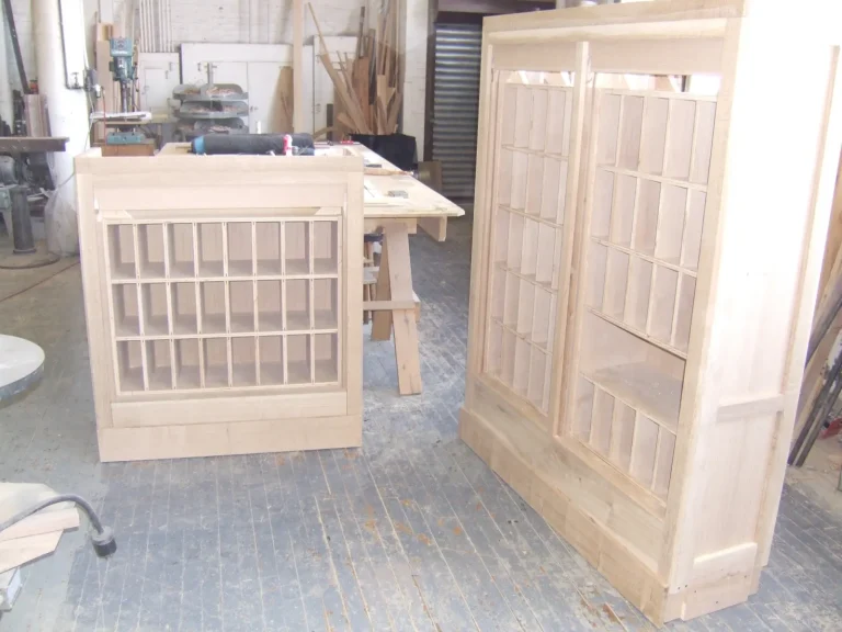Lobby Woodwork — Desk & Cabinet Sculpting & Fabrication — before restoration by Olek Inc.