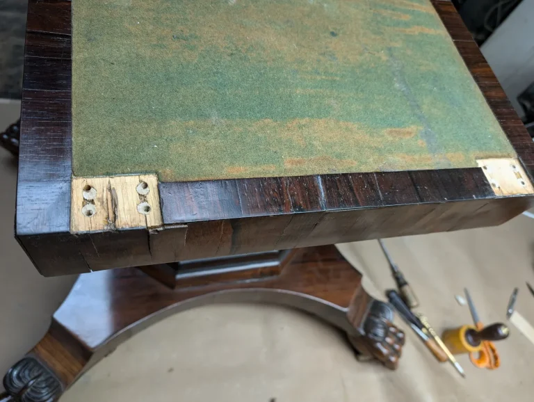 Palisander Regency rosewood table before expert refinishing by Olek Inc.